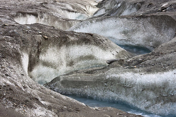 meltwater channel and creek on the surface of glacier Pasterze near Grossglockner