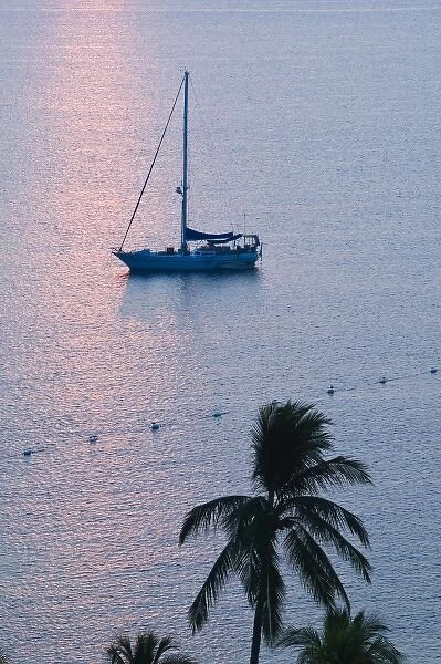 Mexico, Colima, Manzanillo. Manzanillo Bay  /  Sailboat at Sunrise