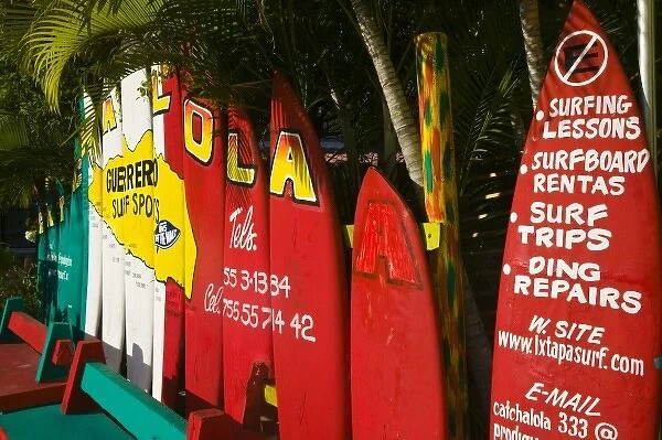 Mexico, Guerrero, Ixtapa. Catcha La Ola Surf Shop Sign