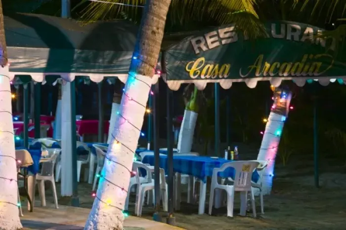 Framed Print : Mexico, Guerrero, Zihuatanejo. Beachside Cafe  /  Playa Municipal  /  Evening