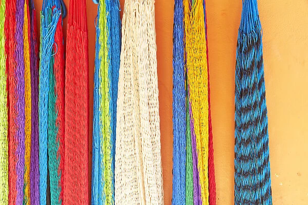 Mexico, Jalisco. Colorful hammocks sold by street vendors