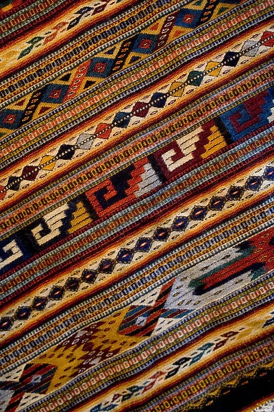 Mexico, Oaxaca, Detail of hand-woven rug using Zapotec Indian design displayed at