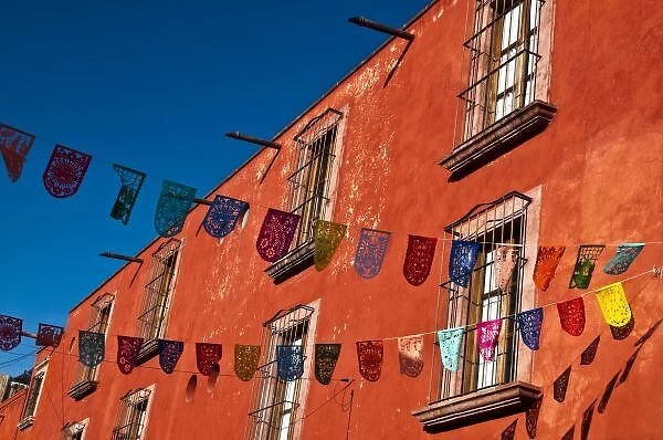 Mexico, San Miguel de Allende. Colorful banners strung across street
