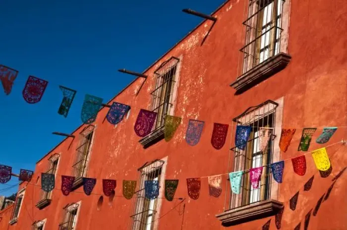 Framed Print : Mexico, San Miguel de Allende. Colorful banners strung across street Framed Print : Mexico, San Miguel de Allende. Colorful banners strung across street
