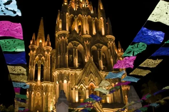 Framed Print : Mexico, San Miguel de Allende. Festival banners fly at night in front of illuminated