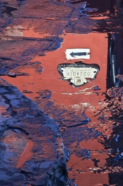 Mexico, San Miguel de Allende. Hidalgo Street sign reflected in puddle