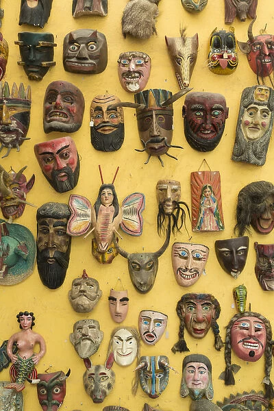 Mexico, San Miguel de Allende. Masks displayed on shop wall