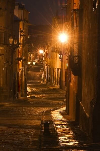 Mexico, San Miguel de Allende. Street with lanterns in pre-dawn