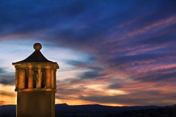 Mexico, San Miguel de Allende. Sunset over building tower. Credit as: Nancy Rotenberg