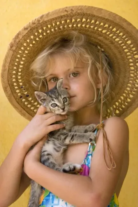 Framed Print : Mexico. Young girl embraces her kitten. (MR)