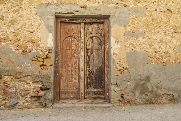 Framed Print : Middle East, Arabian Peninsula, Al Batinah South. Old wooden door on a building in Oman