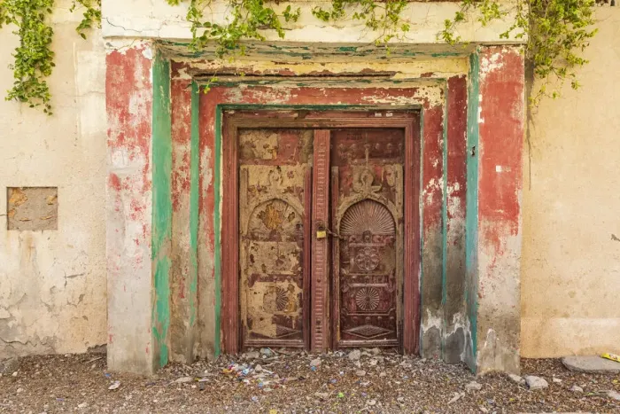 Framed Print : Middle East, Arabian Peninsula, Al Batinah South. Old carved wooden door on a building in