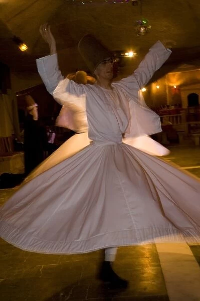 Middle East central part of Turkey in Cappadocia Whirling Dervishes dancing in underground