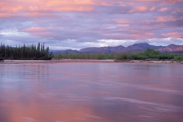 midnight sun over the MacKenzie River, off the Dempster highway in Yukon, Canada