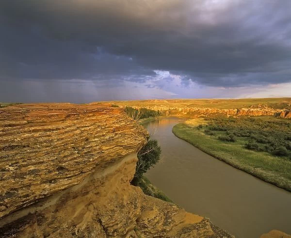 The Milk River runs through badlands of Writing on Stone Provincial Partk in Alberta