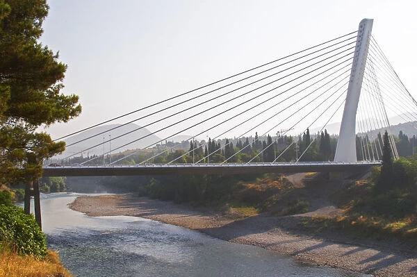 The Millennium Bridge is a cable bridge that spans Moraca River and a single central