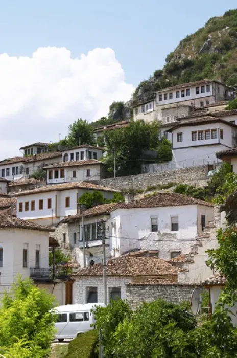 Framed Print : The modern lower part of the village crawling up the hillside with white washed ottoman