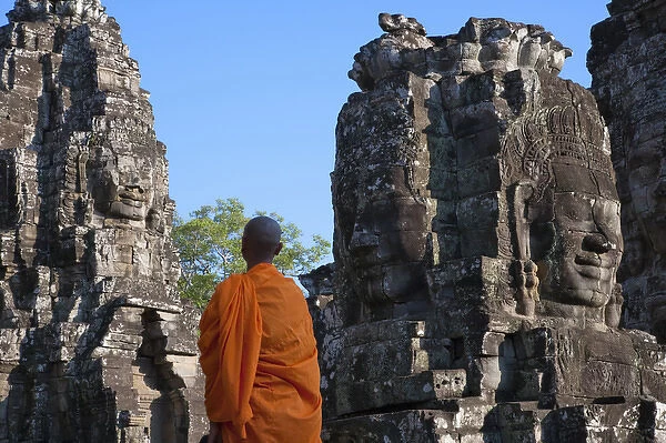 Monk with huge smiling face at Bayon Temple, Angkor Thom, UNESCO World Heritage site