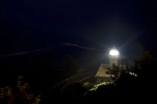 Monte Igueldo Lighthouse at night in La Concha Bay near the city of Donostia-San Sebastian