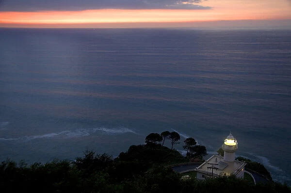 Monte Igueldo Lighthouse at sunset in La Concha Bay near the city of Donostia-San Sebastian