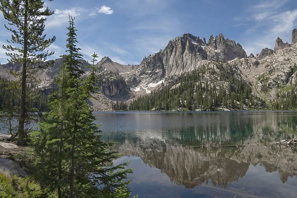 Monte Verita Peak mirrored in still waters of Baron Lake, Sawtooth Mountains Wilderness, Idaho