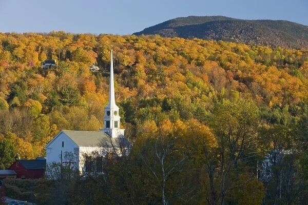 The moon, a church, and fall foliage in Stowe, Vermont