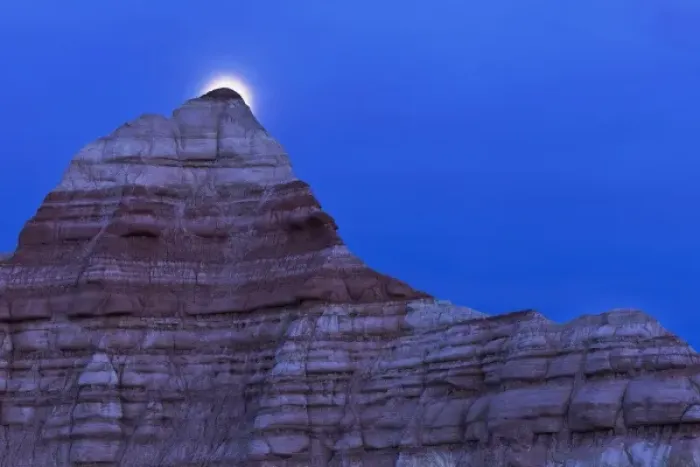 Framed Print : Full moon rises over colorful badlands in the Grand Staircase Escalante National Monument in Utah