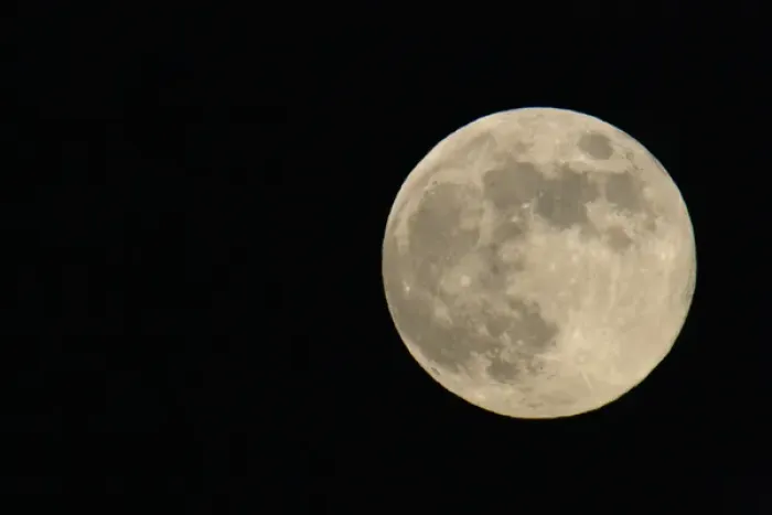 Framed Print : Full moon with yellowish hue to right of frame