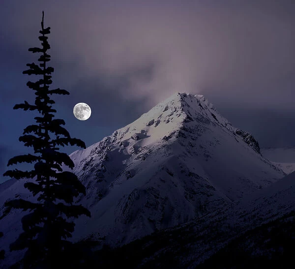 Moonrise over the Canadian Rocky Mountains in Jasper National Park, Alberta, Canada