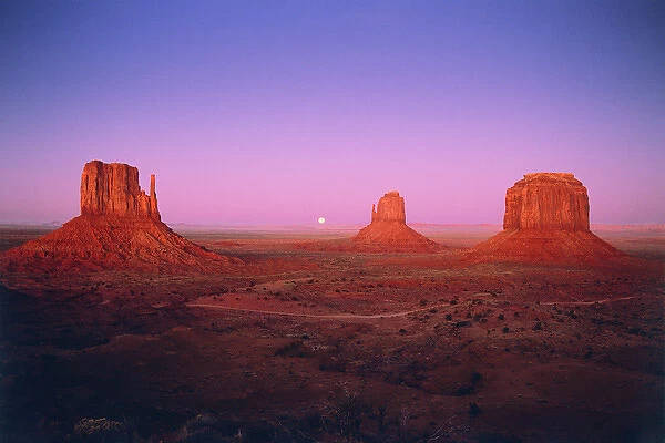 Moonrise between Mitten Buttes in Monument Valley, Navajo Nation, Arizona