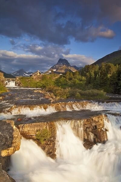 Morning light greets Swiftcurrent Falls in the Many Glacier Valley of Glacier National