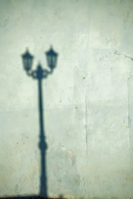 Framed Print : Morning shadow of a lamppost on light blue-green house wall in Trinidad, Cuba