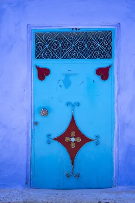Framed Print : Morocco, Chefchaouen. A traditional metal painted door with red heart-like motifs Framed Print : Morocco, Chefchaouen. A traditional metal painted door with red heart-like motifs