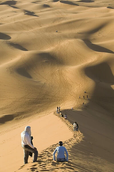 MOROCCO-Tafilalt-MERZOUGA: Erg Chebbi Dunes (up to 400 ft in height) and visitors (NR)