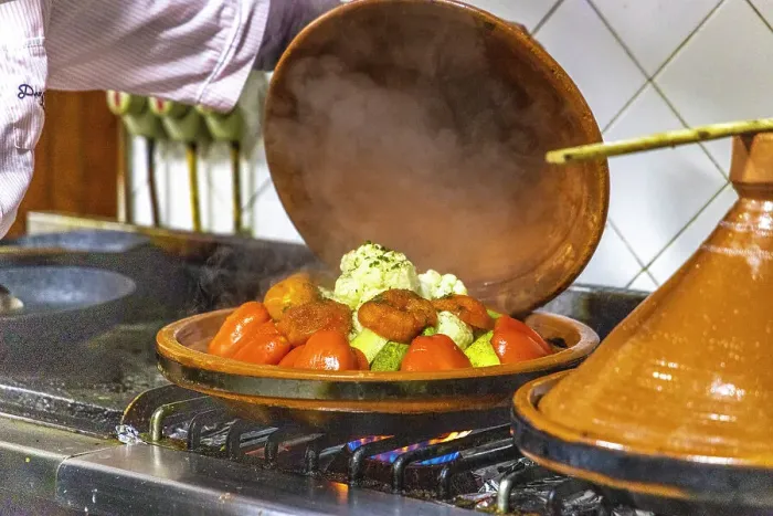 Framed Print : Morocco, Taroudant Province. Hotel Dar Zitoune, cooking food in a tagine