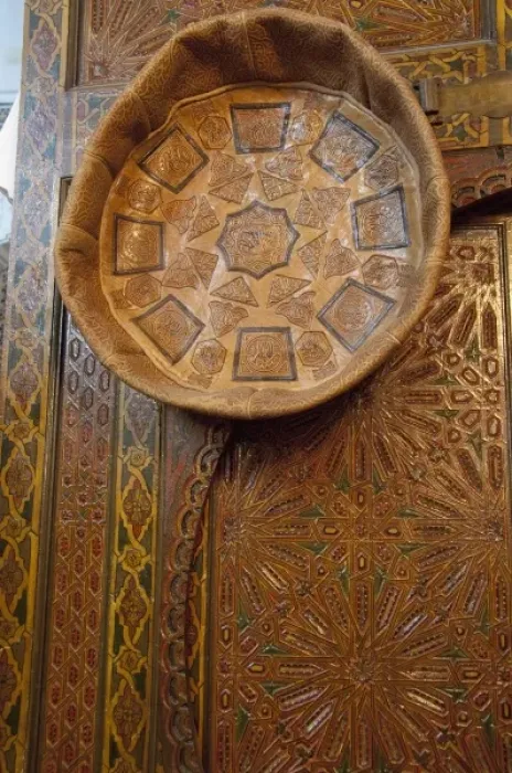 Framed Print : Morocco, Tetouan. Historic medina bazaar. Tooled leather seat hanging on ornate wooden door Framed Print : Morocco, Tetouan. Historic medina bazaar. Tooled leather seat hanging on ornate wooden door