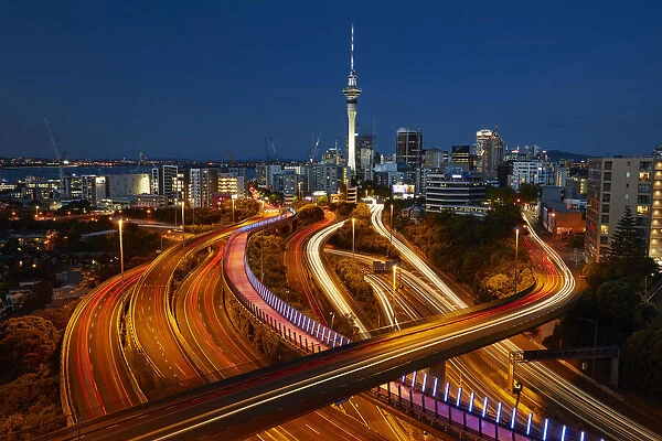 Motorways, Lightpath cycleway, and Skytower at dusk, Auckland, North Island, New Zealand