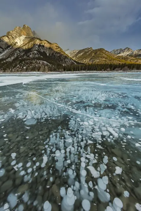 Framed Print : Mount Abraham at sunrise with methane ice bubbles under clear ice on Abraham Lake near Nordegg Framed Print : Mount Abraham at sunrise with methane ice bubbles under clear ice on Abraham Lake near Nordegg
