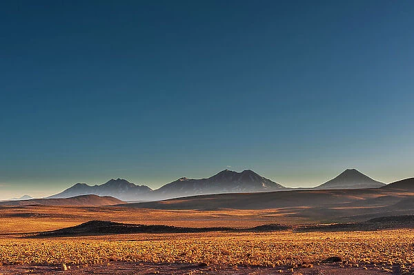 Mountain peaks and desert landscape seen from the road to Paso Sico. Atacama Desert, Antofagasta Region, Chile