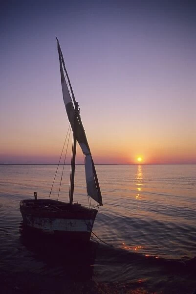 Mozambique: Bazaruto Archipelago, Benguerra Island, local fishing boat, sunset