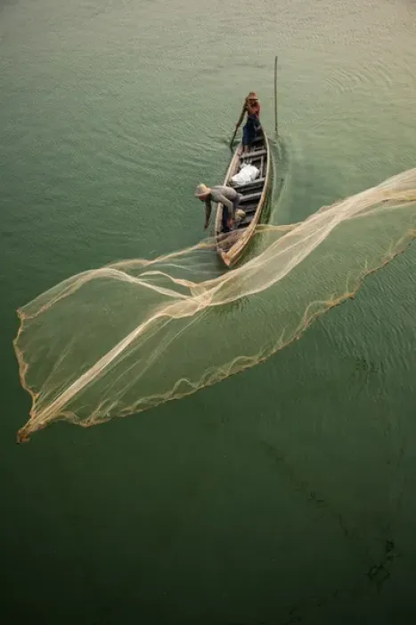Framed Print : Myanmar, Mandalay, Amarapura. Fisherman casting net on Irrawaddy River. Credit as