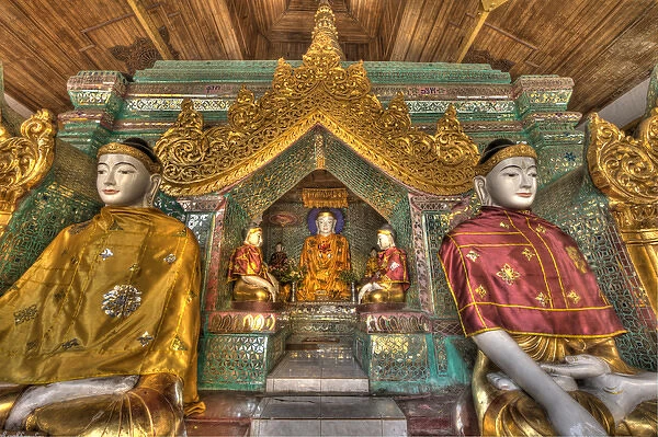 Myanmar, Yangon. Buddha statues in Schwedagon Temple