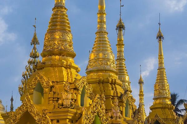 Myanmar. Yangon. Shwedagon Pagoda. Golden spires gleam at twilight
