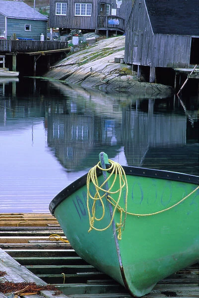 N. A. Canada, Nova Scotia, Peggys Cove. Green dinghy in harbor