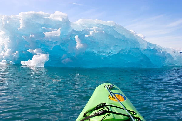 N. A. USA, Alaska. Kayaking near a large iceberg in and around the Columbia Glacier