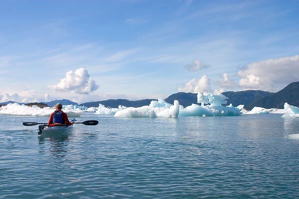 N. A. USA, Alaska. Tourists kayaking in and around Columbia Glacier