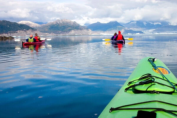 N. A. USA, Alaska. Tourists kayaking in and around Columbia Glacier