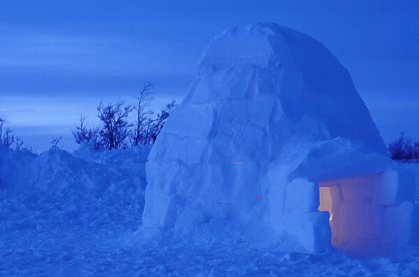NA, Canada, Manitoba, Churchill Arctic igloo with candle light inside