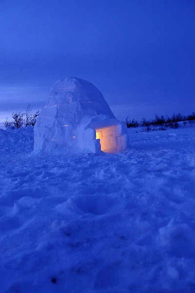 NA, Canada, Manitoba, Churchill Arctic igloo with candle light inside