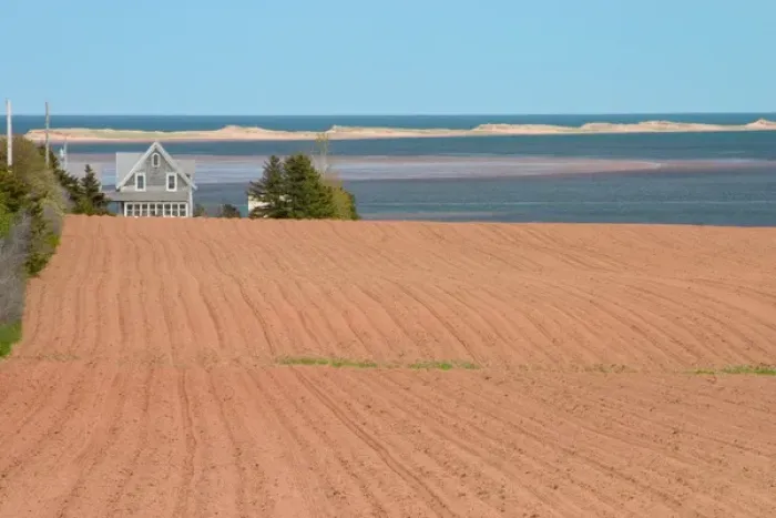 Framed Print : NA, Canada, Prince Edward Island, Springbrook. Field ready for planting and home Framed Print : NA, Canada, Prince Edward Island, Springbrook. Field ready for planting and home